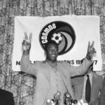 
              FILE- Pele of the New York Cosmos gestures during a press conference in New York on Sept. 29, 1977. Dozens of meetings over four years led to Pelé agreeing to sign with Cosmos in June 1975. His 2 1/2 seasons in New York elevated the sport, putting U.S. soccer on a path to hosting the World Cup in 1994 and launching Major League Soccer two years later.  (AP Photo/Ira Schwarz, File)
            
