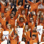 
              Members of the Virginia pep band cheer for their team against Florida State during the first half of an NCAA college basketball game in Charlottesville, Va., Saturday, Dec. 3, 2022. (AP Photo/Mike Kropf)
            