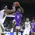 
              Tarleton State guard Tiger Booker shoots over Baylor forward Flo Thamba (0) in the first half of an NCAA college basketball game, Tuesday, Dec. 6, 2022, in Waco, Texas. (AP Photo/Rod Aydelotte)
            