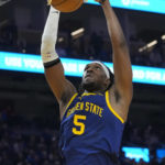 
              Golden State Warriors center Kevon Looney (5) dunks against the Chicago Bulls during the first half of an NBA basketball game in San Francisco, Friday, Dec. 2, 2022. (AP Photo/Godofredo A. Vásquez)
            