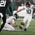 
              Jacksonville Jaguars place kicker Riley Patterson (10) kicks a field goal against the New York Jets during the second quarter of an NFL football game, Thursday, Dec. 22, 2022, in East Rutherford, N.J. (AP Photo/Seth Wenig)
            