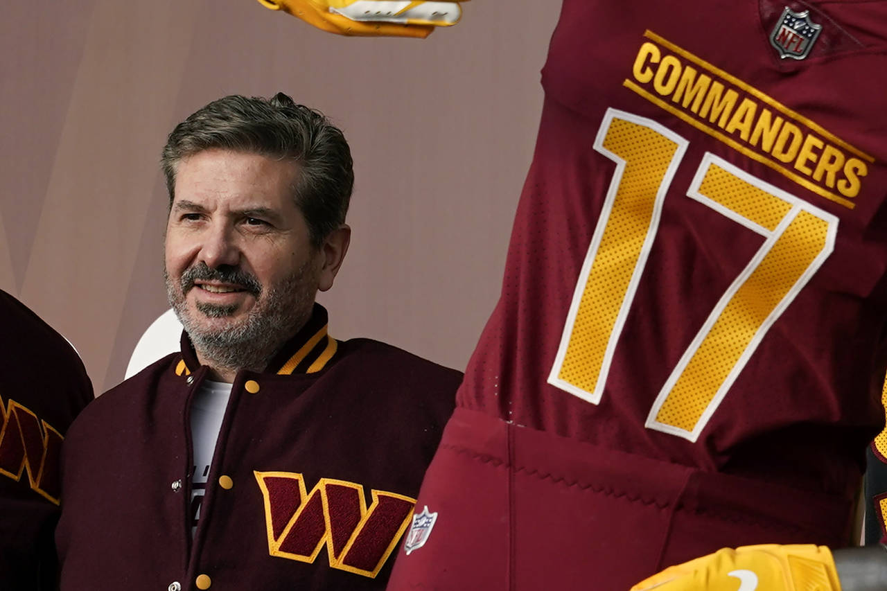 FILE - Washington Commanders owner Dan Snyder poses for photos during an event to unveil the NFL fo...