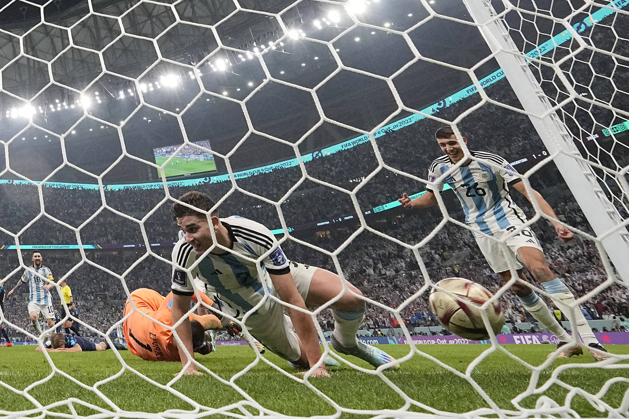 Argentina's Julian Alvarez, centre, celebrates after scoring his side's second goal past Croatia's ...