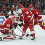 
              Detroit Red Wings goaltender Ville Husso (35) stops a Ottawa Senators center Rourke Chartier (67) shot in the first period of an NHL hockey game Saturday, Dec. 17, 2022, in Detroit. (AP Photo/Paul Sancya)
            