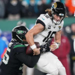 
              New York Jets defensive tackle Quinnen Williams (95) sacks Jacksonville Jaguars quarterback Trevor Lawrence (16) to force a fumble during the first quarter of an NFL football game, Thursday, Dec. 22, 2022, in East Rutherford, N.J. (AP Photo/Frank Franklin II)
            