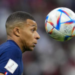 
              France's Kylian Mbappe attempts to control the ball during the World Cup quarterfinal soccer match between England and France, at the Al Bayt Stadium in Al Khor, Qatar, Saturday, Dec. 10, 2022. (AP Photo/Natacha Pisarenko)
            