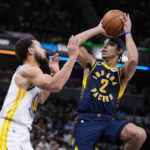 
              Indiana Pacers guard Andrew Nembhard (2) shoots over Golden State Warriors guard Stephen Curry (30) during the second half of an NBA basketball game in Indianapolis, Wednesday, Dec. 14, 2022. The Pacers defeated the Warriors 125-119. (AP Photo/Michael Conroy)
            