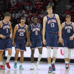 
              Arizona players walk on the court during the first half of the team's NCAA college basketball game against Utah on Thursday, Dec. 1, 2022, in Salt Lake City. (AP Photo/Rick Bowmer)
            