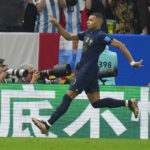 
              France's Kylian Mbappe celebrates after he scored during the World Cup final soccer match between Argentina and France at the Lusail Stadium in Lusail, Qatar, Sunday, Dec. 18, 2022. (AP Photo/Petr David Josek)
            