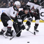 
              Los Angeles Kings right wing Gabriel Vilardi (13) tries to get a shot off with Arizona Coyotes defenseman Jakob Chychrun defending during the second period of an NHL hockey game in Los Angeles, Thursday, Dec. 1, 2022. (AP Photo/Alex Gallardo)
            