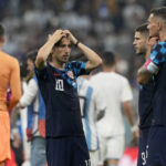 
              Croatia's Luka Modric, Andrej Kramaric and Dejan Lovren, from left, react at the end of the World Cup semifinal soccer match between Argentina and Croatia at the Lusail Stadium in Lusail, Qatar, Tuesday, Dec. 13, 2022. Argentina won 3-0. (AP Photo/Frank Augstein)
            