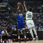 
              Los Angeles Clippers' Kawhi Leonard (2) shoots under pressure by Boston Celtics' Marcus Smart during first half of an NBA basketball game, Monday, Dec. 12, 2022, in Los Angeles. (AP Photo/Jae C. Hong)
            