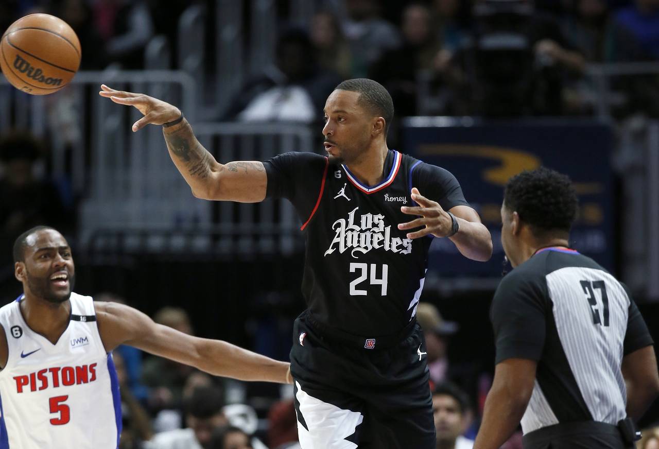 Los Angeles Clippers forward Norman Powell (24) passes the ball against Detroit Pistons guard Alec ...
