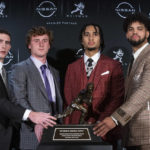 
              FILE - The Heisman trophy finalists, from left, Georgia quarterback Stetson Bennett, TCU quarterback Max Duggan, Ohio State quarterback C.J. Stroud and Southern California quarterback Caleb Williams, stand for a photo with the trophy before attending the award ceremony on Dec. 10, 2022, in New York. Duggan has thrown for 3,321 yards with 30 touchdowns and only four interceptions, and run for 404 yards with six more scores, heading into the Fiesta Bowl on Dec. 31. (AP Photo/Eduardo Munoz Alvarez, File)
            
