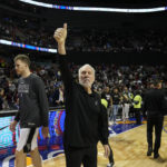 
              San Antonio Spurs head coach Gregg Popovich flashes a thumb up after losing to the Miami Heat at the end of an NBA basketball game, at the Mexico Arena in Mexico City, Saturday, Dec. 17, 2022. The Heat won 111-101. (AP Photo/Fernando Llano)
            