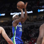 
              Dallas Mavericks guard Kemba Walker shoots against the Chicago Bulls during the first half of an NBA basketball game in Chicago, Saturday, Dec. 10, 2022. (AP Photo/Nam Y. Huh)
            