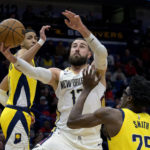
              New Orleans Pelicans center Jonas Valanciunas (17) shoots against Indiana Pacers guard Tyrese Haliburton, left, and Indiana Pacers forward Jalen Smith (25) in the first half of an NBA basketball game in New Orleans, Monday, Dec. 26, 2022. (AP Photo/Matthew Hinton)
            
