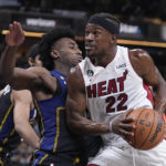
              Miami Heat's Jimmy Butler (22) goes to the basket against Indiana Pacers' Aaron Nesmith, front left, during the first half of an NBA basketball game, Monday, Dec. 12, 2022, in Indianapolis. (AP Photo/Darron Cummings)
            