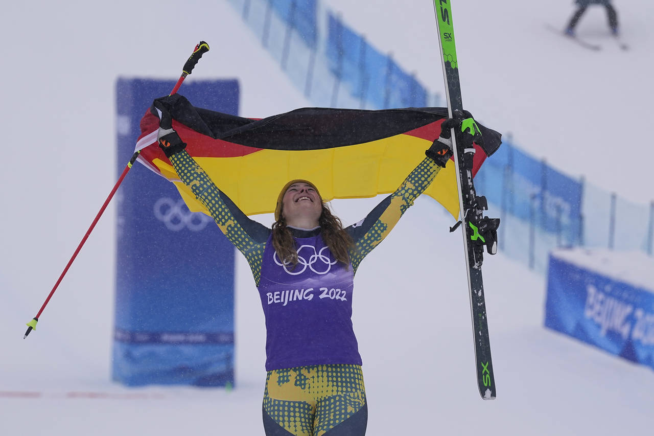 FILE  - Bronze medal winner Germany's Daniela Maier celebrates during the venue award ceremony for ...