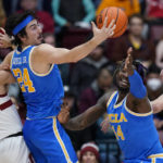 
              Stanford guard Isa Silva (1) and UCLA guard Jaime Jaquez Jr. (24) compete for possession of the ball during the first half of an NCAA college basketball game in Stanford, Calif., Thursday, Dec. 1, 2022. (AP Photo/Godofredo A. Vásquez)
            