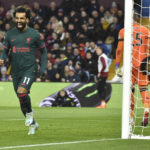 
              Liverpool's Mohamed Salah celebrates after scoring his side's opening goal during the English Premier League soccer match between Aston Villa and Liverpool at Villa Park in Birmingham, England, Monday, Dec. 26, 2022. (AP Photo/Rui Vieira)
            