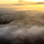 
              The castle of the city of Kronberg is surrounded by fog near Frankfurt, Germany, Sunday, Nov. 27, 2022. (AP Photo/Michael Probst)
            