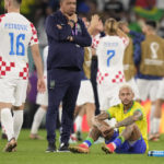 
              Brazil's Neymar sits on the pitch at the end of the World Cup quarterfinal soccer match between Croatia and Brazil, at the Education City Stadium in Al Rayyan, Qatar, Friday, Dec. 9, 2022. (AP Photo/Darko Bandic)
            