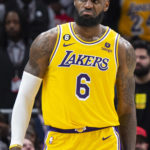 
              Los Angeles Lakers forward LeBron James reacts during the first half of an NBA basketball game against the Atlanta Hawks, Friday, Dec. 30, 2022, in Atlanta. (AP Photo/Hakim Wright Sr.)
            