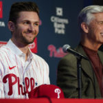 
              Newly acquired Philadelphia Phillies shortstop Trea Turner, left, smiles during his introductory news conference with president of baseball operations David Dombrowski, Thursday, Dec. 8, 2022, in Philadelphia. (AP Photo/Matt Slocum)
            