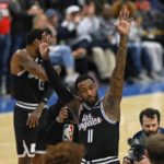 
              Los Angeles Clippers guard John Wall (11) acknowledges the crowd during the first quarter of the team's NBA basketball game against the Washington Wizards, Saturday, Dec. 10, 2022, in Washington. (AP Photo/Terrance Williams)
            