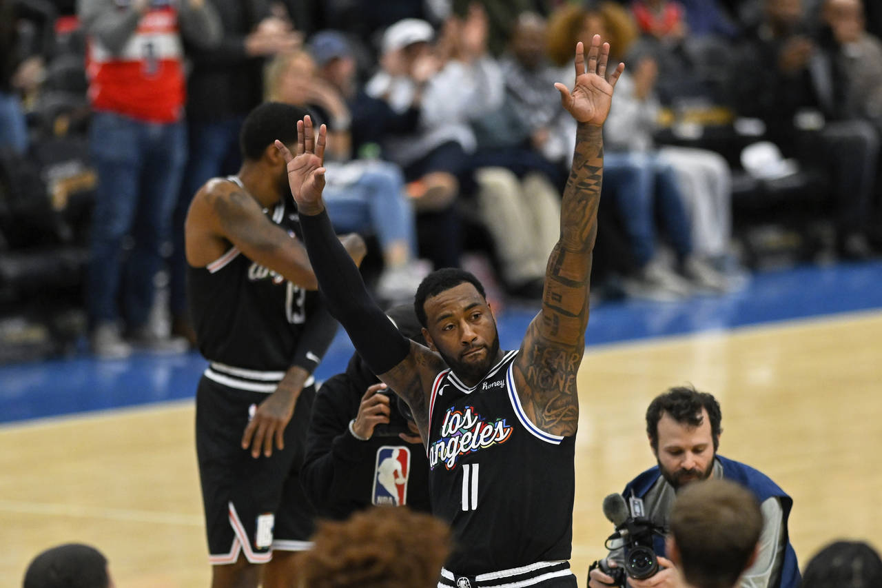 Los Angeles Clippers guard John Wall (11) acknowledges the crowd during the first quarter of the te...