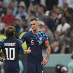 
              Croatia's Luka Modric, left, and Croatia's Dejan Lovren shake hands after the World Cup semifinal soccer match between Argentina and Croatia at the Lusail Stadium in Lusail, Qatar, Tuesday, Dec. 13, 2022. (AP Photo/Martin Meissner)
            