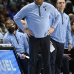 
              Memphis Grizzlies head coach Taylor Jenkins watches his team play against the Detroit Pistons during the second half of an NBA basketball game, Sunday, Dec. 4, 2022, in Detroit. (AP Photo/Jose Juarez)
            