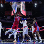 
              Philadelphia 76ers' Joel Embiid (21) goes up for a shot during the second half of an NBA basketball game against the Los Angeles Clippers, Friday, Dec. 23, 2022, in Philadelphia. (AP Photo/Matt Slocum)
            