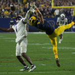 
              Michigan wide receiver Ronnie Bell (8) can't make the catch as TCU cornerback Tre'Vius Hodges-Tomlinson (1) defends during the second half of the Fiesta Bowl NCAA college football semifinal playoff game, Saturday, Dec. 31, 2022, in Glendale, Ariz. Hodges-Tomlinson was called for pass interference on the play. (AP Photo/Rick Scuteri)
            