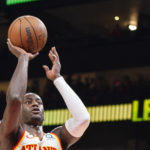 
              Atlanta Hawks forward AJ Griffin shoots during the first half of the team's NBA basketball game against the Denver Nuggets on Friday, Dec. 2, 2022, in Atlanta. (AP Photo/Hakim Wright Sr.)
            
