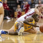 
              Indiana guard Sydney Parrish, top, reacts as she and Morehead State guard Veronica Charles (0) battle for a loose ball during the second half of an NCAA college basketball game, Sunday, Dec. 18, 2022, in Bloomington, Ind. (AP Photo/Doug McSchooler)
            