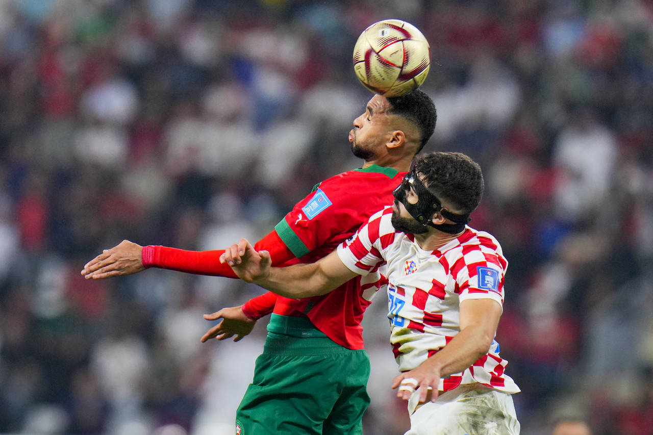 Morocco's Youssef En-Nesyri, left, and Croatia's Josko Gvardiol fight for the ball during the World...
