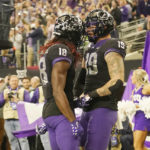 
              TCU tight end Jared Wiley (19) and wide receiver Savion Williams (18) celebrate a two-point conversion by Wiley in the second half of the Big 12 Conference championship NCAA college football game, Saturday, Dec. 3, 2022, in Arlington, Texas. (AP Photo/LM Otero)
            