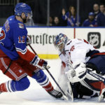 
              Washington Capitals goaltender Darcy Kuemper makes a save against New York Rangers right wing Julien Gauthier (12) during the second period of an NHL hockey game Tuesday, Dec. 27, 2022, in New York. (AP Photo/Adam Hunger)
            
