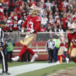 
              San Francisco 49ers quarterback Brock Purdy (13) celebrates after running for a touchdown against the Tampa Bay Buccaneers during the first half of an NFL football game in Santa Clara, Calif., Sunday, Dec. 11, 2022. (AP Photo/Jed Jacobsohn)
            