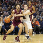 
              Florida State's Jalen Warley (1) drives with the ball against Virginia during the first half of an NCAA college basketball game in Charlottesville, Va., Saturday, Dec. 3, 2022. (AP Photo/Mike Kropf)
            