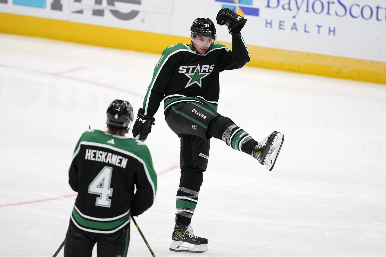 Dallas Stars left wing Jason Robertson celebrates his third goal of the night against the Anaheim D...