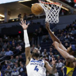 
              Minnesota Timberwolves guard Jaylen Nowell (4) shoots over Indiana Pacers center Myles Turner (33) during the first quarter of an NBA basketball game Wednesday, Dec. 7, 2022, in Minneapolis. (AP Photo/Andy Clayton-King)
            