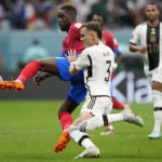 
              Costa Rica's Joel Campbell, left, and Germany's David Raum challenge for the ball during the World Cup group E soccer match between Costa Rica and Germany at the Al Bayt Stadium in Al Khor , Qatar, Thursday, Dec. 1, 2022. (AP Photo/Martin Meissner)
            