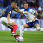 
              France's Kylian Mbappe, left, and England's Kyle Walker complete for the ball during the World Cup quarterfinal soccer match between England and France, at the Al Bayt Stadium in Al Khor, Qatar, Saturday, Dec. 10, 2022. (AP Photo/Natacha Pisarenko)
            
