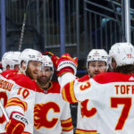 
              The Calgary Flames celebrate after center Nazem Kadri, center, scored against the Seattle Kraken during the second period of an NHL hockey game Wednesday, Dec. 28, 2022, in Seattle. (AP Photo/Lindsey Wasson)
            