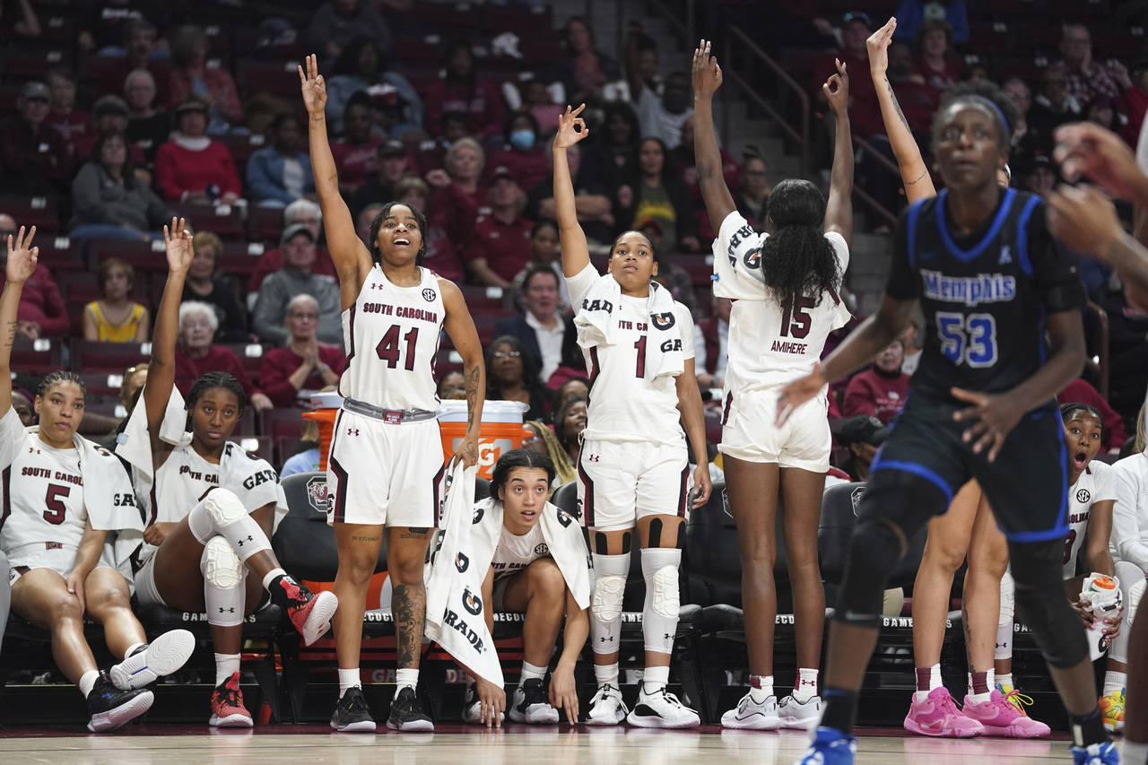 South Carolina players react to a three point attempt during the second half of an NCAA college bas...