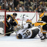 
              Pittsburgh Penguins' Jake Guentzel (59) cannot reach the puck behind Vegas Golden Knights goaltender Logan Thompson (36) during the second period of an NHL hockey game in Pittsburgh, Thursday, Dec. 1, 2022. (AP Photo/Gene J. Puskar)
            