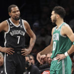 
              Brooklyn Nets forward Kevin Durant (7) interacts with Boston Celtics forward Jayson Tatum (0) during the second half of an NBA basketball game, Sunday, Dec. 4, 2022, in New York. (AP Photo/Jessie Alcheh)
            